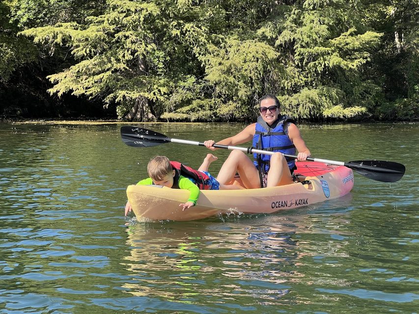 Wendy kayaking on a lake
