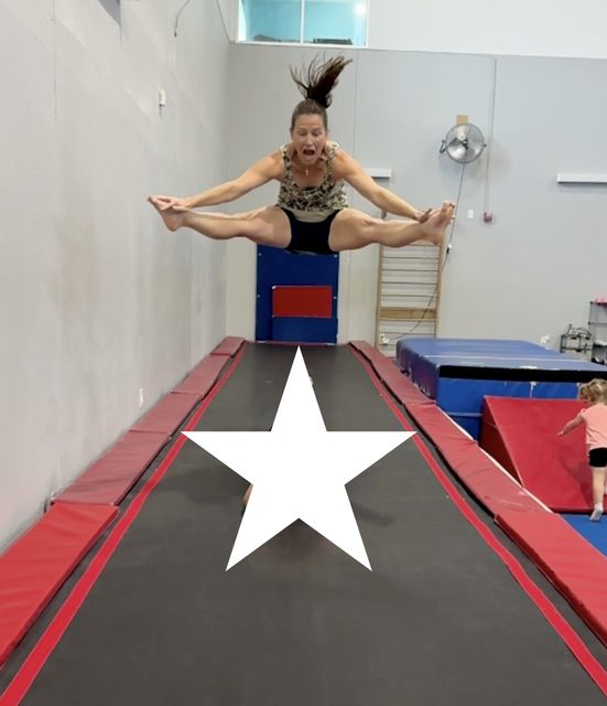 Wendy doing a straddle jump on a gymnastics tumble track