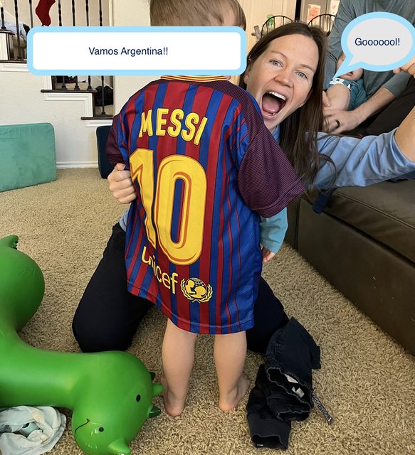 Wendy cheering on Argentina with a child in a Messi jersey