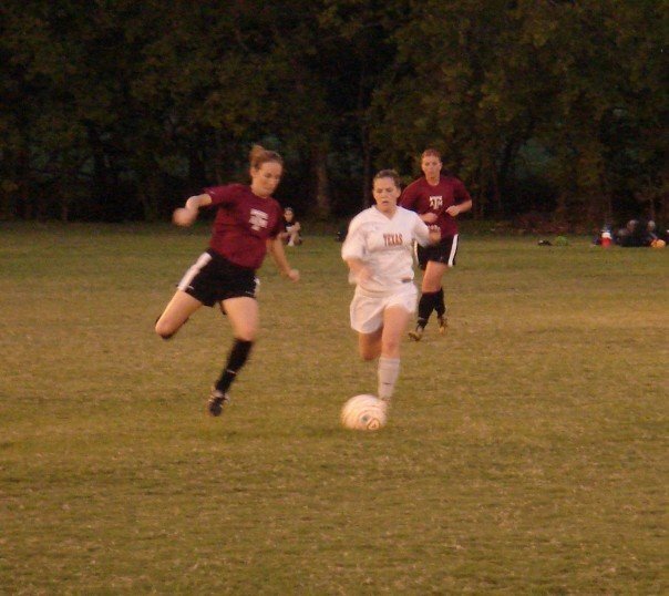 Wendy playing soccer for the University of Texas