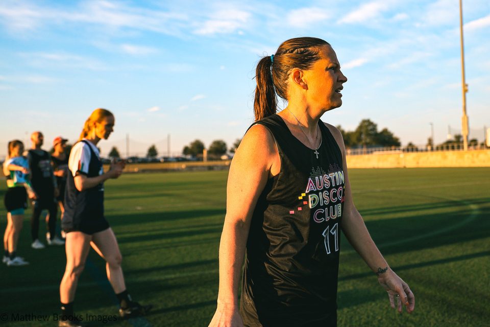 Wendy on the field at sunset in her Austin Disco Club jersey